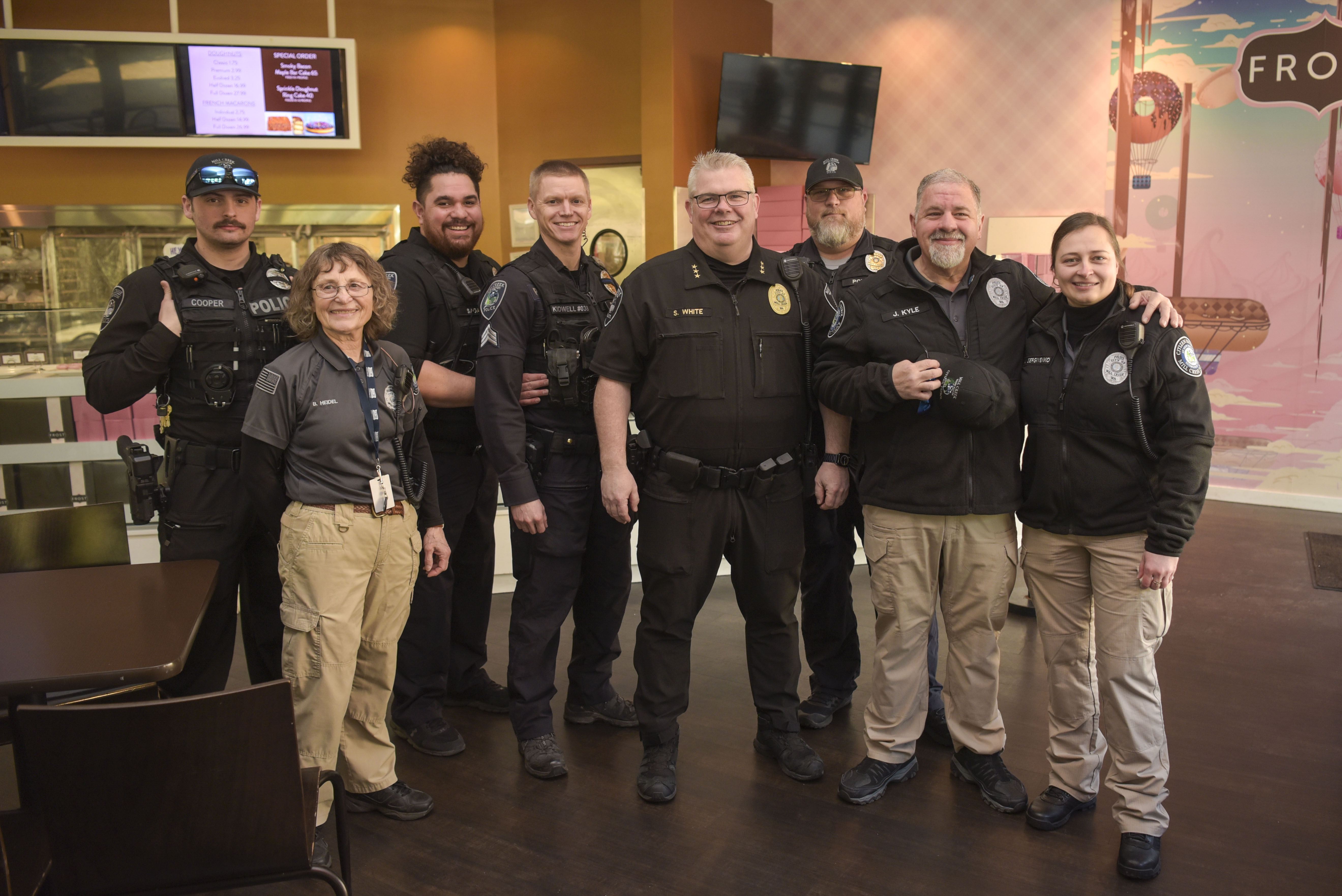 Officers and Citizens Patrol pose for a photo during Coffee With A Cop