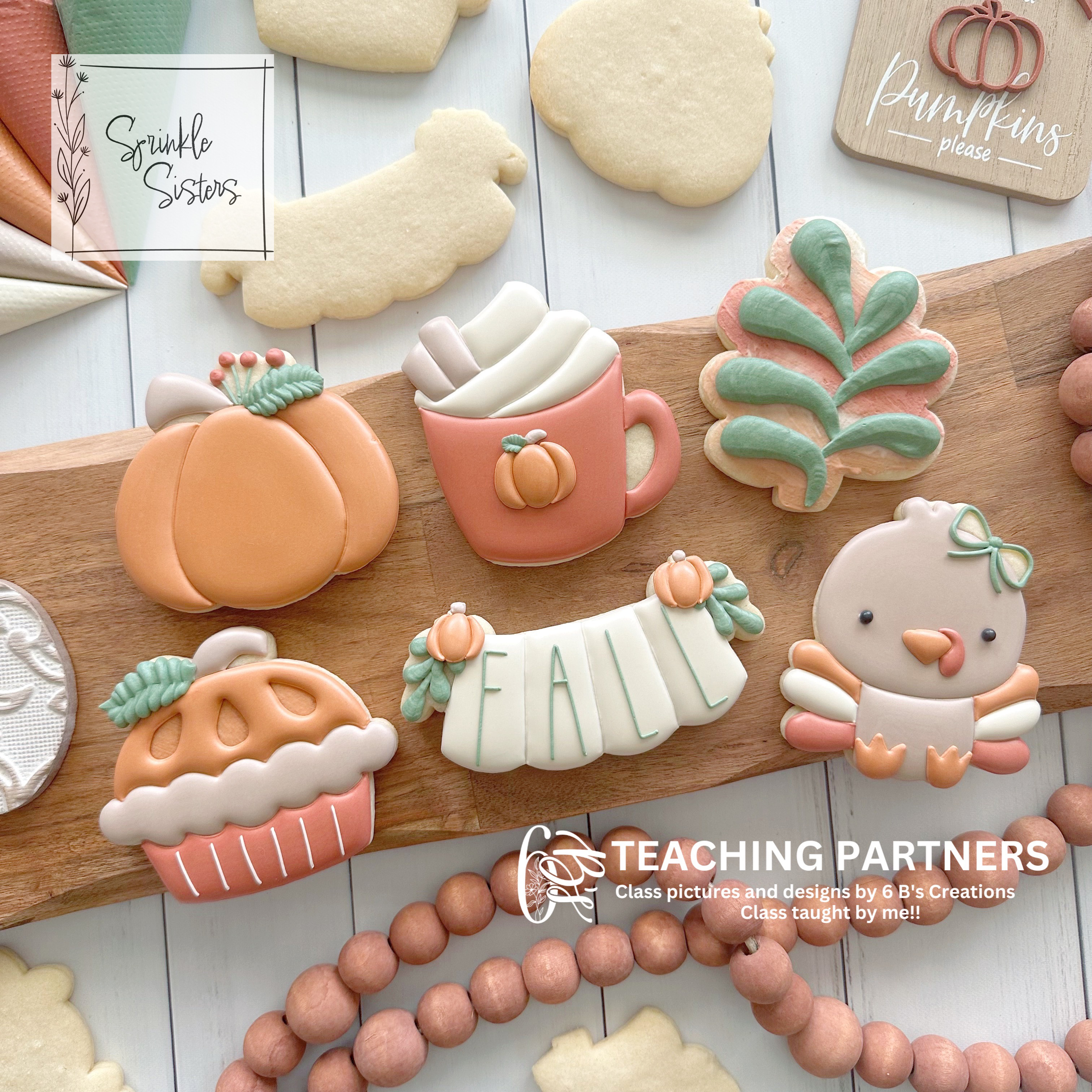 Fall themed royal icing cookies on a cutting board.