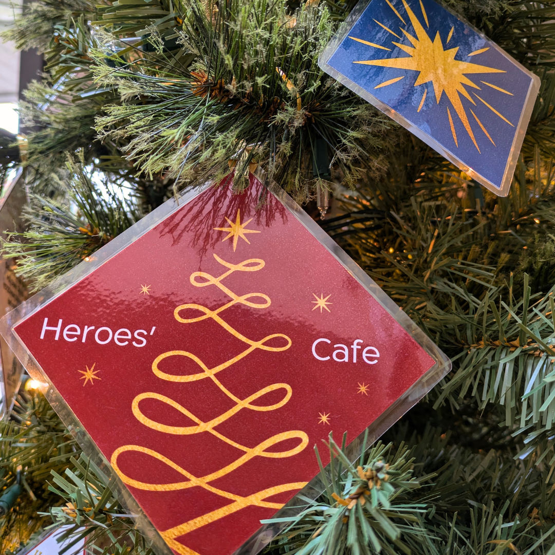 Heroes Cafe Giving Tree gift tags hung on tree.