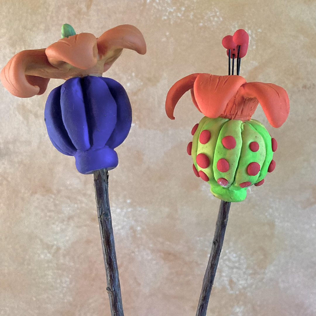 clay flower sculptures on sticks