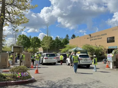 Kiwanis Electronics Recycling event with cars coming in for electronics drop off at City Hall.