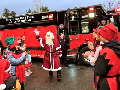 Santa greets his elves