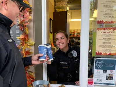 National Coffee with a Cop with coffee handed out a drive-thru window