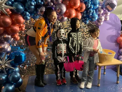 Trunk-or-Treat on Main - trunk or treaters at a vendor photobooth.